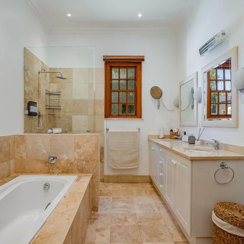 En-suite bathroom with bathtub