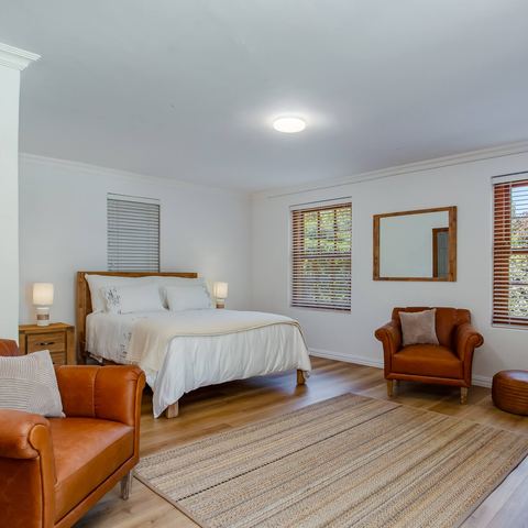 Bedroom with leather armchairs