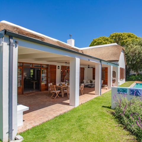 Thatched veranda and lawn